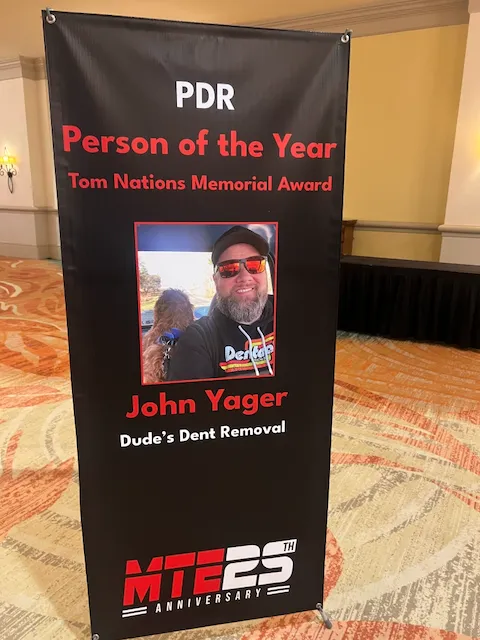 PDR Person of the Year banner at Mobile Tech Expo naming John Yager of Dude's Dent Removal — Tom Nations Memorial Award